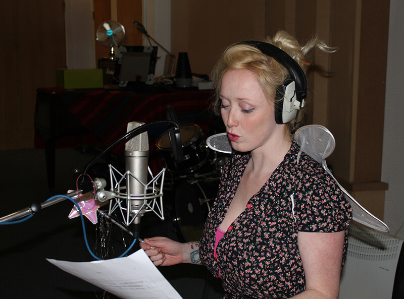 Kiria Ceinwen with her fairy wings on recording the voice of Butterfly the fairy in our audio book Chris the Caterpillar image